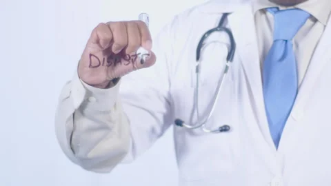 A doctor writes on the screen words Disaster pants Stock Footage 248579755