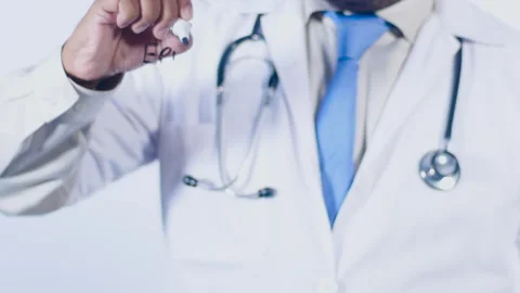 A doctor writes on the screen words Epipen Stock Footage 248552156