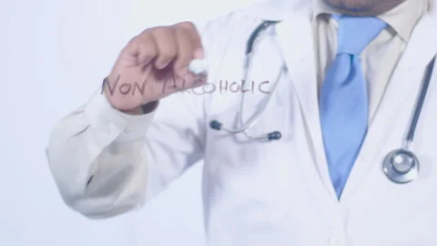 A doctor writes on the screen words Non Alcoholic Fatty Liver Disease Stock Footage 248573209