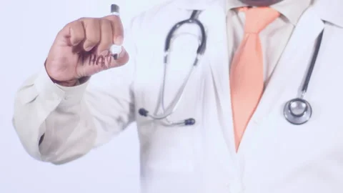 A doctor writes on the screen words That's dumb Stock Footage 248583241