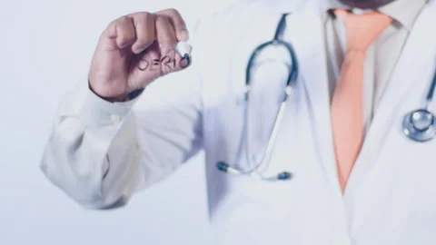 A doctor writes on the screen words Seriously Stock Footage 248557060