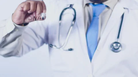 A doctor writes on the screen words Snake bite Stock Footage 248548640