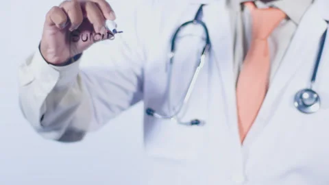 A doctor writes on the screen words Suicide hotline Stock Footage 248543066