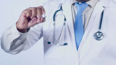 A doctor writes on the screen words Top 10 foods Stock Footage 248571273