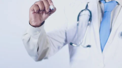 A doctor writes on the screen words The Truth Stock Footage 248558494