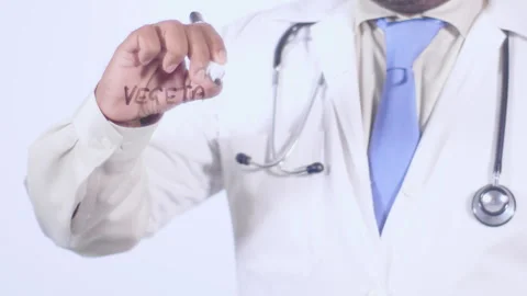 A doctor writes on the screen words Vegetative state Stock Footage 248578495