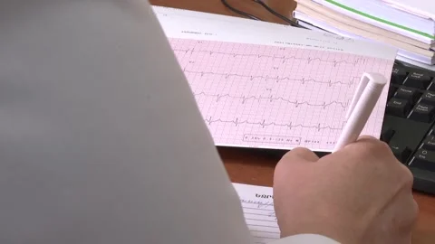 The doctor writes something down 2 Video stock 317083892