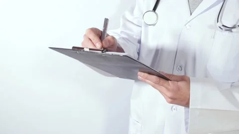 Doctor writes standing Stock Footage 152930250