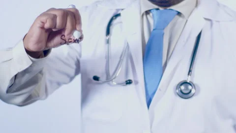 A Doctor Writes On transparent glass words Sexercise Stock Footage 248564128
