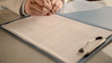Doctor writing Stock Footage 60668056