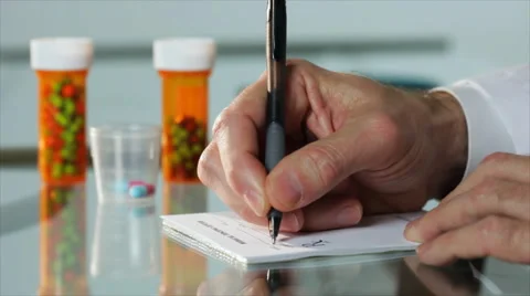 Doctor writing a prescription Stock Footage