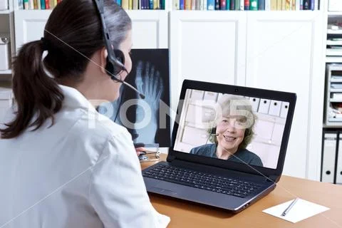 Doctor x-ray laptop patient telehealth Stock Photos