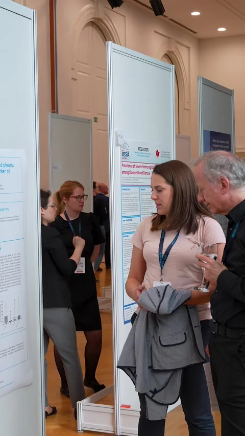 Doctoral Researcher Presenting at Scientific Poster to Colleagues Stock Footage 334775008