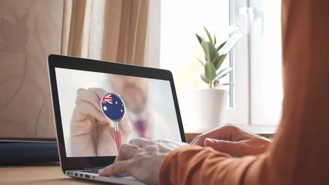 Doctor's advice on computer app, stethoscope with the Australian flag Stock Footage 129853576