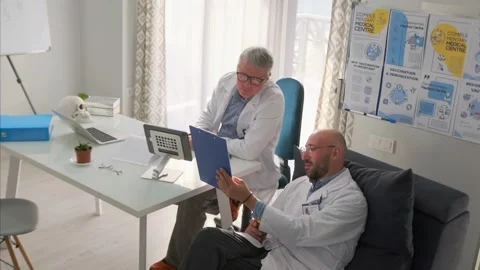 Doctors analyzing pharmaceutical research data in modern medical office 스톡 동영상 316355765