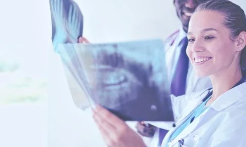 Doctors analyzing an x-ray in a meting. Doctors Stock-Fotos