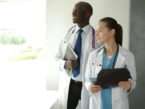 Doctors analyzing an x-ray in a meting. Doctors Stock Photos