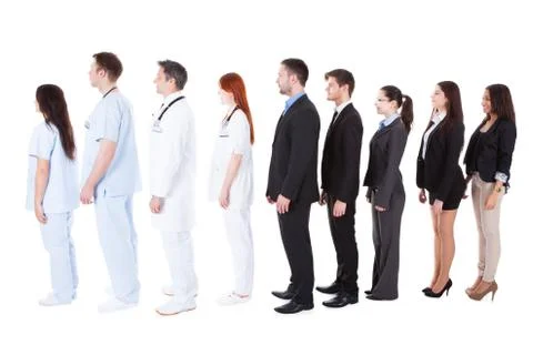 Doctors and managers standing in queue Stock Photos