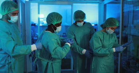 Doctors and nurse preparing to work in hospital Stock Footage 149116924