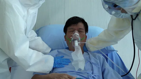 Doctors and nurses are helping to treat patients with covid 19 Stock Footage 132273994