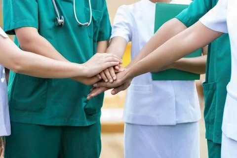 Doctors and nurses coordinate hands. Concept Teamwork Stock Photos