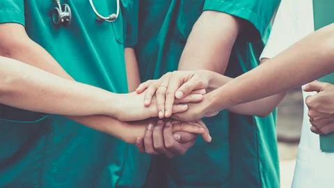 Doctors and nurses coordinate hands. Concept Teamwork Foto stock