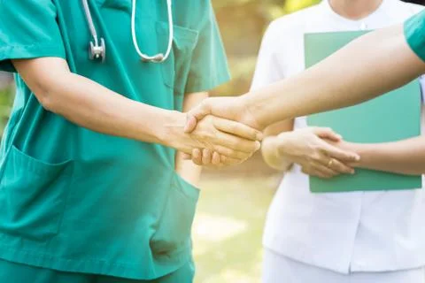 Doctors and nurses coordinate hands. Concept Teamwork Stock Photos