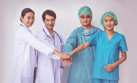 Doctors and Nurses coordinate hands. Concept Teamwork Stock Photos