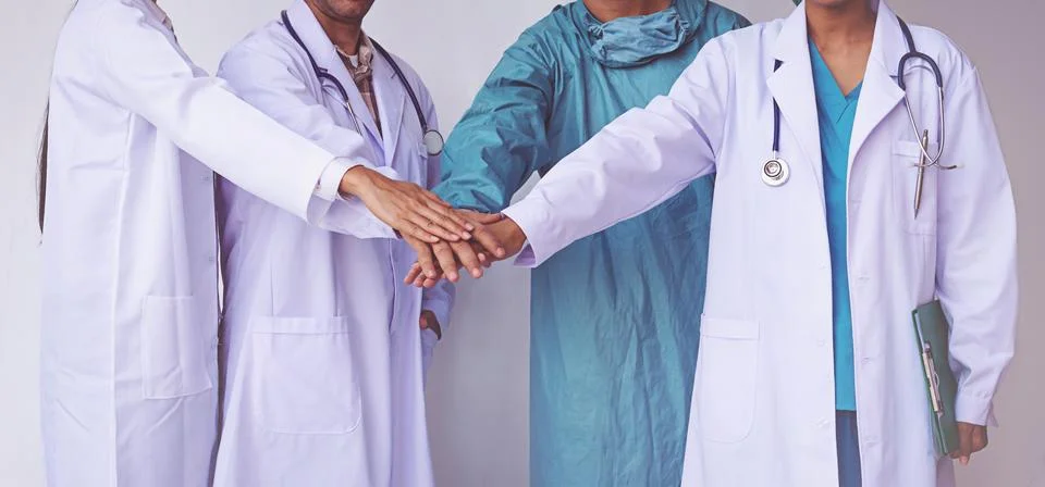 Doctors and Nurses coordinate hands. Concept Teamwork Stock Photos