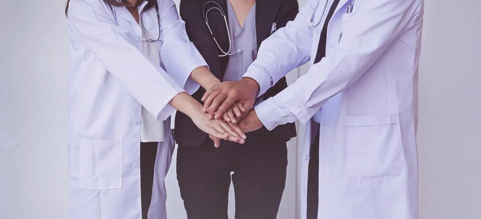 Doctors and Nurses coordinate hands. Concept Teamwork Stock Photos