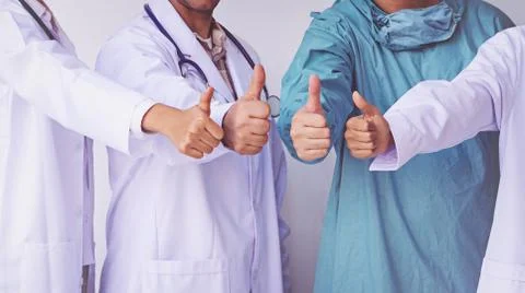 Doctors and Nurses coordinate hands.doctors thumb up, Concept Teamwork Stock Photos