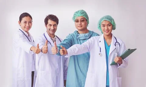 Doctors and Nurses coordinate hands.doctors thumb up, Concept Teamwork Stock Photos