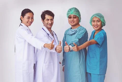 Doctors and Nurses coordinate hands.doctors thumb up, Concept Teamwork Stock Photos