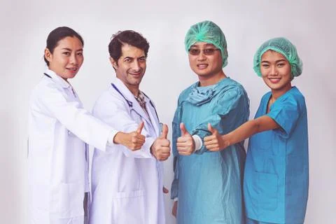 Doctors and Nurses coordinate hands.doctors thumb up, Concept Teamwork Foto stock