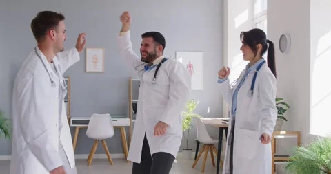 Doctors And Nurses Dancing And Celebrating Success In Clinic Office Stock Footage 292765175