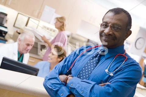 Photograph: Doctors And Nurses At The Reception Area Of A Hospital ...