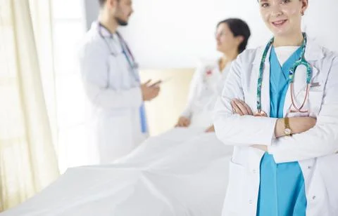 Doctors and nurses stacking hands. Isolated on white Stock Photos