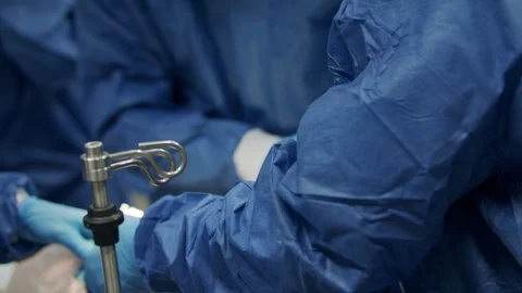 Doctors and nurses treating a wounded patient in a hospital Emergency room Stock Footage 126925630