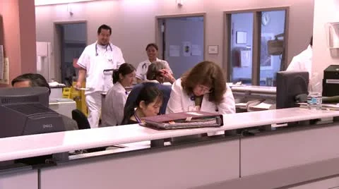Doctors and nurses working at the work station Stock Footage 10903132