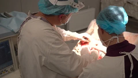 Doctors are doing surgery in modern operating room Stock Footage 194357684
