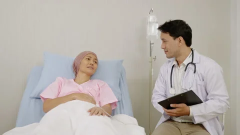Doctors are examining and questioning the symptoms of a sick patient Stock Footage 158628684