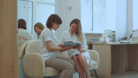 Doctors are studying the book Stock Footage 314312631