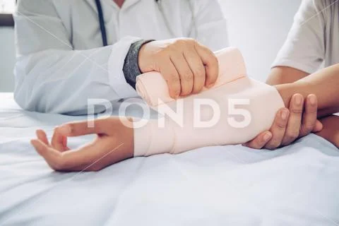 Doctors are treating patients with arm injuries Stock Photos