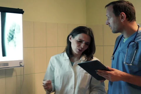 Doctors arguing during checking results of lungs examination in hopsital NTSC Stock Footage 44353816