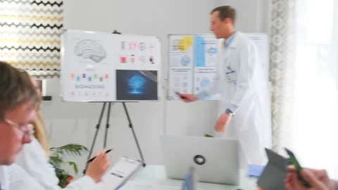 Doctors attending neuroscience lecture with biohacking presentation Stock Footage 316293259