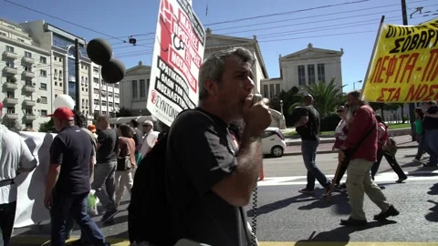 Doctors with banner and megaphone protesting against the underfunding of the Stock-Footage 142966481