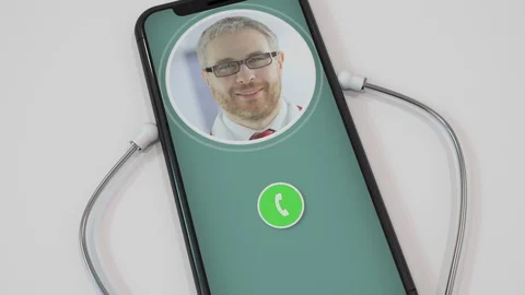 Doctor's call on smartphone with attached stethoscope. Telemedicine or modern Stock Footage 127629591