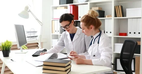 Doctors comparing data in documents. Stock Footage 91350494