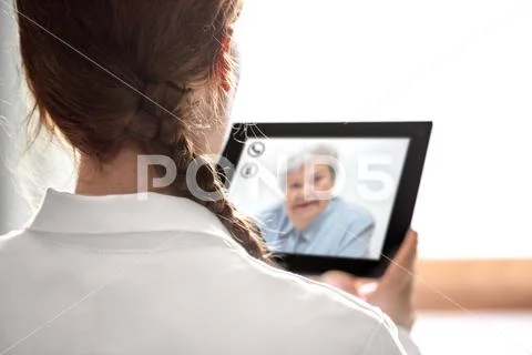 Doctors consultation with telemedicine or telehealth, elderly woman on the di Stock Photos