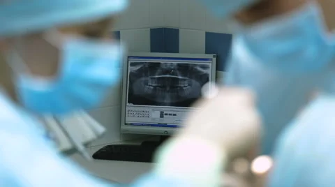 Doctors dentists on the background of the x-ray picture Stock Footage 68056273